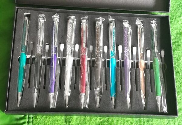 10 x glitter top propelling pen boxed set with spare refills box has storage marks - Image 3